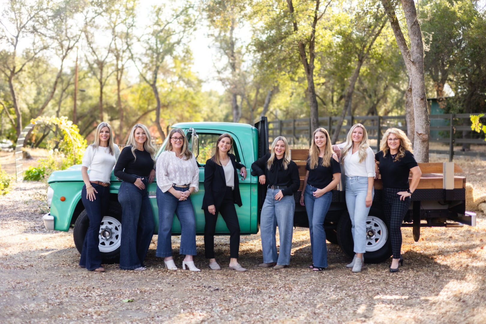 A group of women standing next to each other.